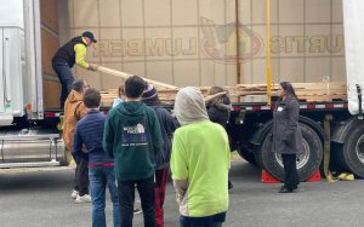 Schuylerville Middle School students unloading wood 